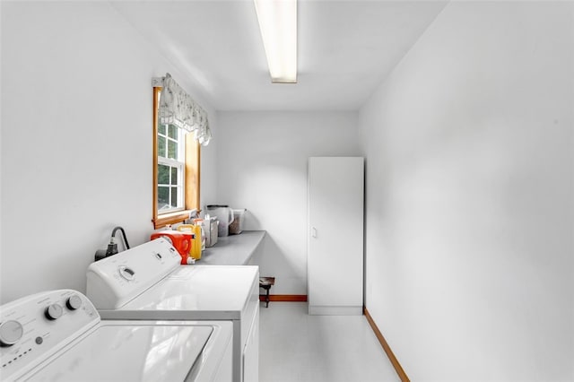 washroom featuring washer and clothes dryer