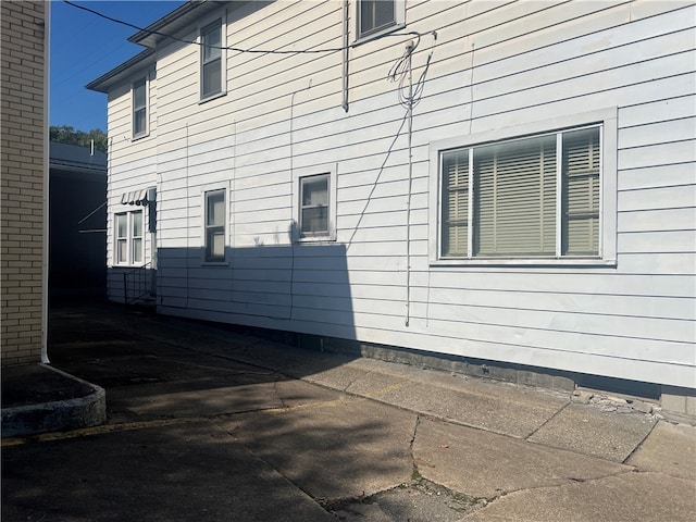 view of side of property with a patio