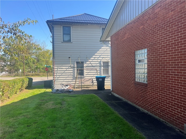 view of property exterior featuring a yard