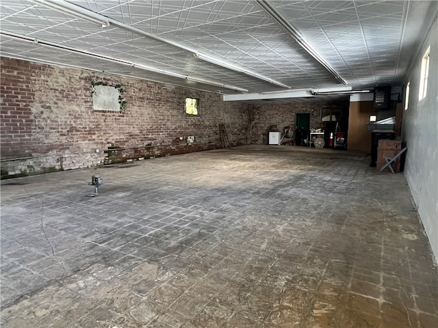 basement with brick wall