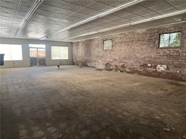 interior space featuring brick wall