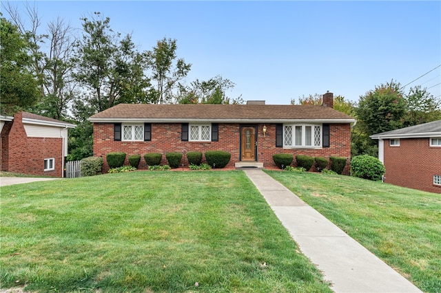 single story home featuring a front yard