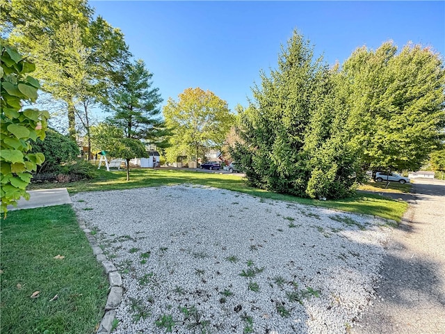 view of home's community featuring a lawn