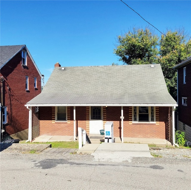 view of front of property featuring covered porch