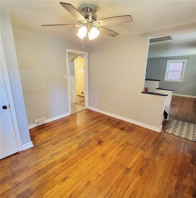 unfurnished room with ceiling fan and light wood-type flooring