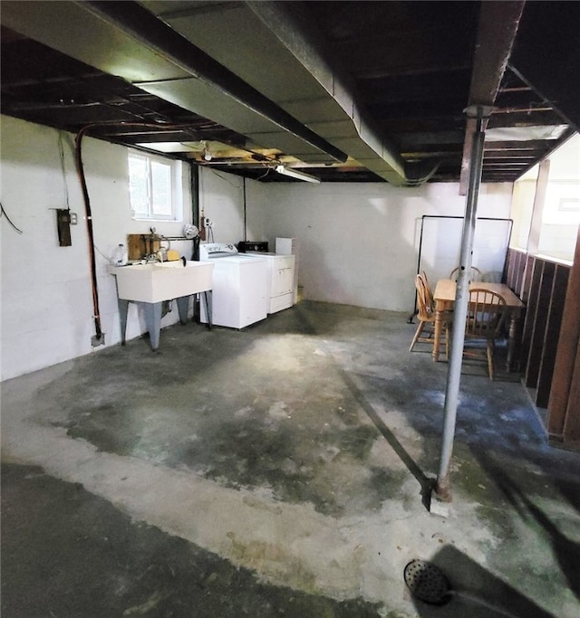 basement with separate washer and dryer and sink