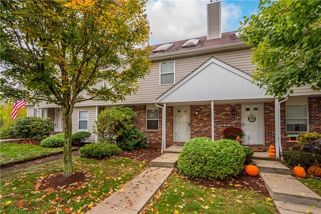 townhome / multi-family property with covered porch