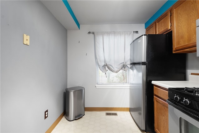 kitchen with white gas range