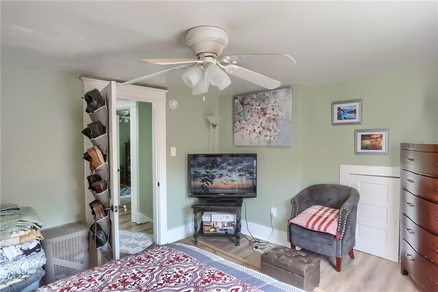 bedroom featuring light hardwood / wood-style floors and ceiling fan