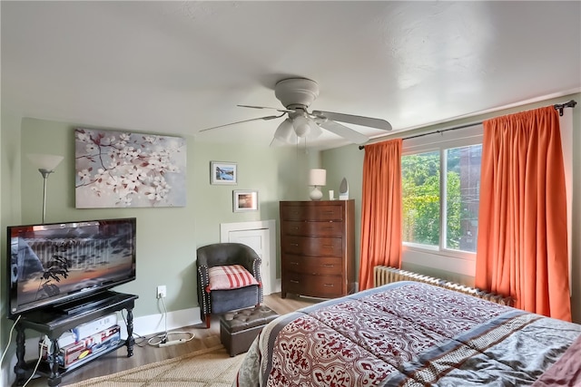 bedroom with hardwood / wood-style floors and ceiling fan