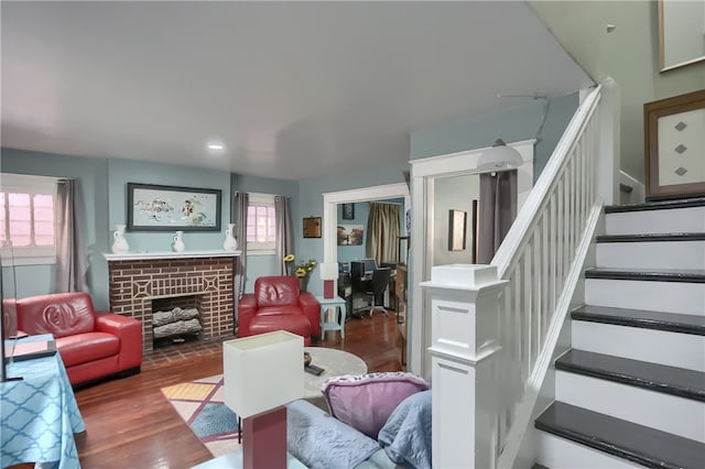 living room with a fireplace and dark hardwood / wood-style floors