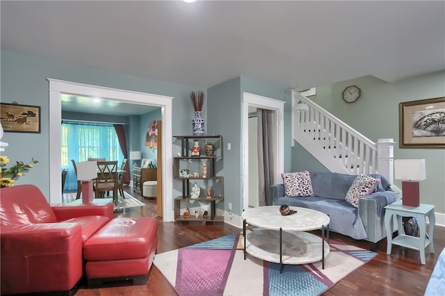 living room featuring dark wood-type flooring