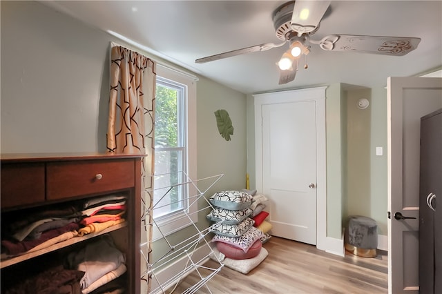 bedroom with ceiling fan and light hardwood / wood-style flooring