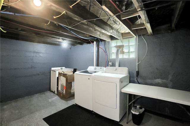 clothes washing area featuring washing machine and clothes dryer