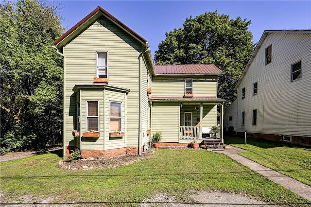 view of front property featuring a front yard and a porch