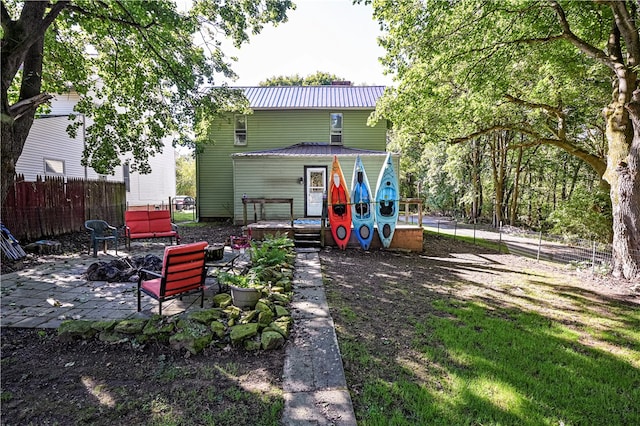 back of house with a patio