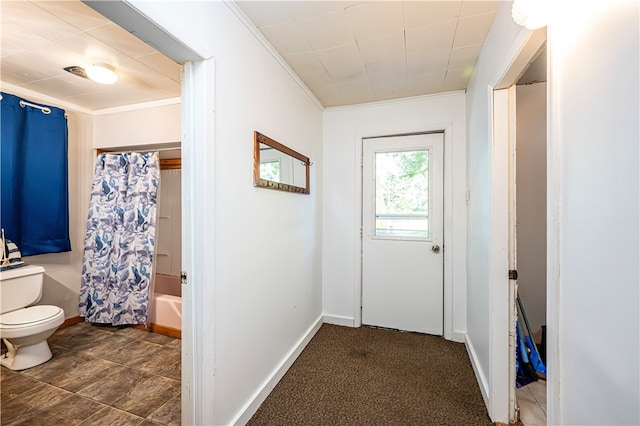 doorway to outside with crown molding