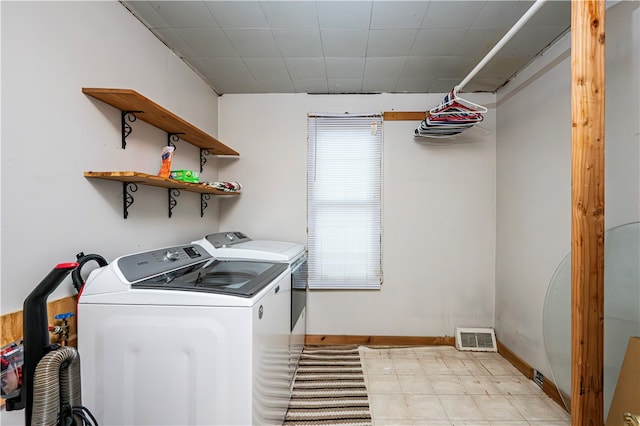 laundry area with separate washer and dryer