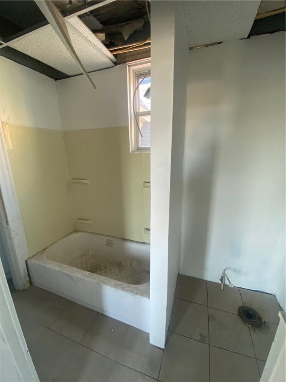 bathroom featuring plus walk in shower and tile patterned flooring