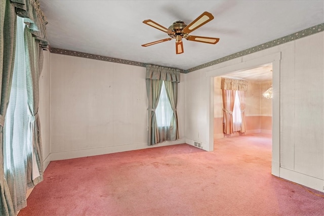 spare room featuring ceiling fan and carpet flooring