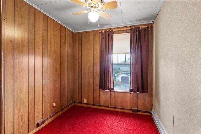 unfurnished room with ceiling fan, carpet flooring, and ornamental molding