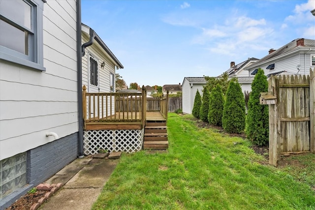 view of yard with a wooden deck