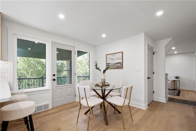 dining room with light hardwood / wood-style flooring