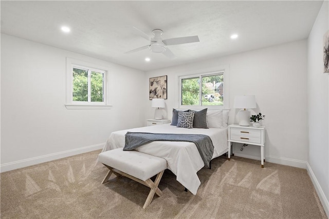 bedroom with light carpet and ceiling fan