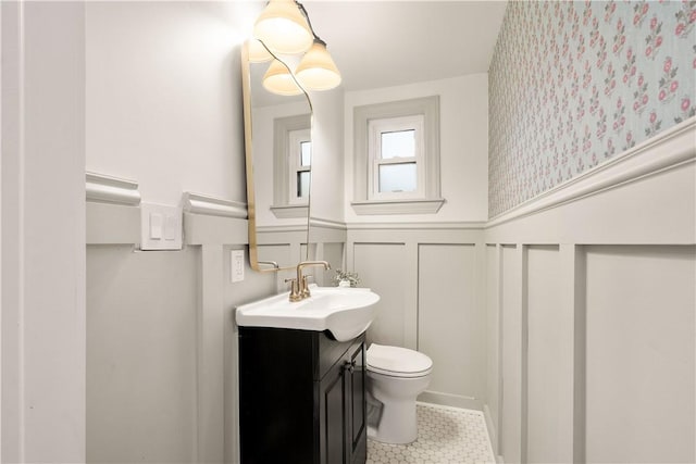 bathroom with tile patterned floors, vanity, and toilet