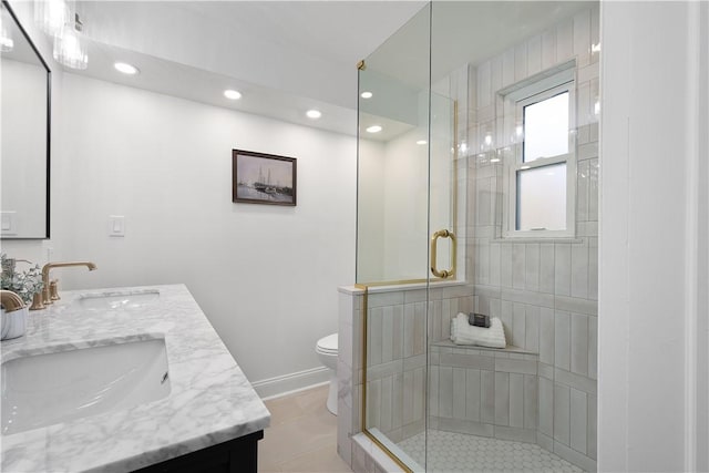 bathroom featuring vanity, toilet, and walk in shower