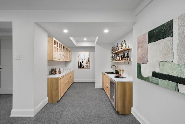 bar featuring dark carpet, a raised ceiling, sink, and wine cooler