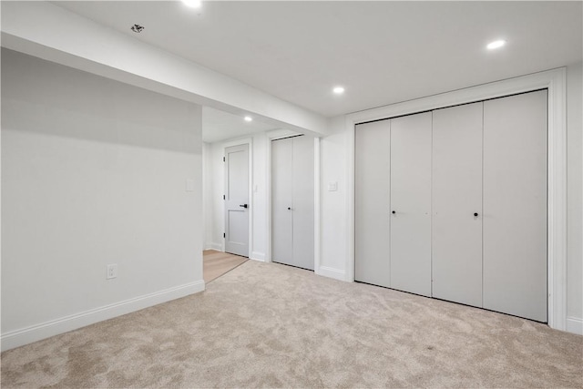 unfurnished bedroom with light carpet