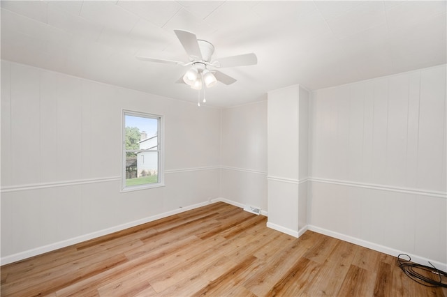 spare room featuring ceiling fan and light wood-type flooring