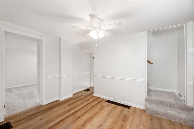 unfurnished room with ceiling fan and light hardwood / wood-style floors