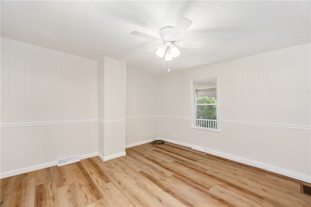 spare room featuring ceiling fan and hardwood / wood-style flooring