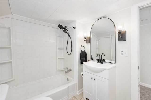 full bathroom with tiled shower / bath, vanity, tile patterned flooring, and toilet