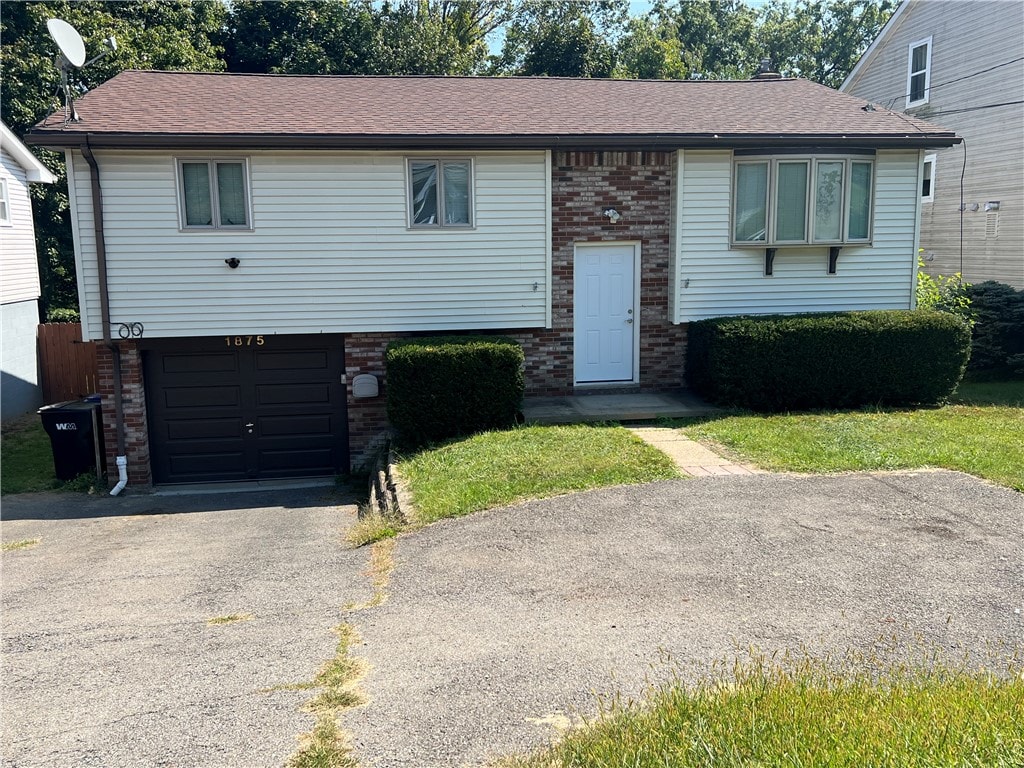 split foyer home featuring a garage