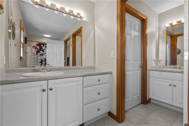 bathroom with vanity and tile patterned flooring