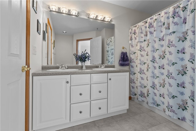 bathroom with vanity, a shower with shower curtain, and tile patterned floors