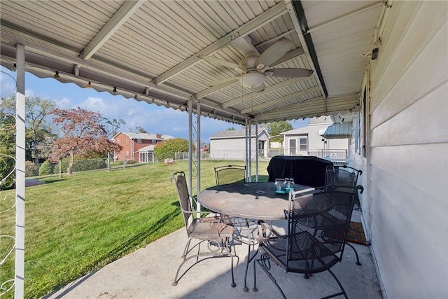 view of patio / terrace with a storage unit and ceiling fan