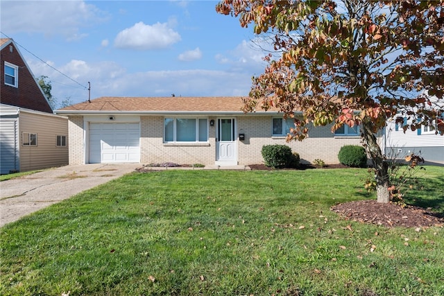 ranch-style house featuring a front yard and a garage