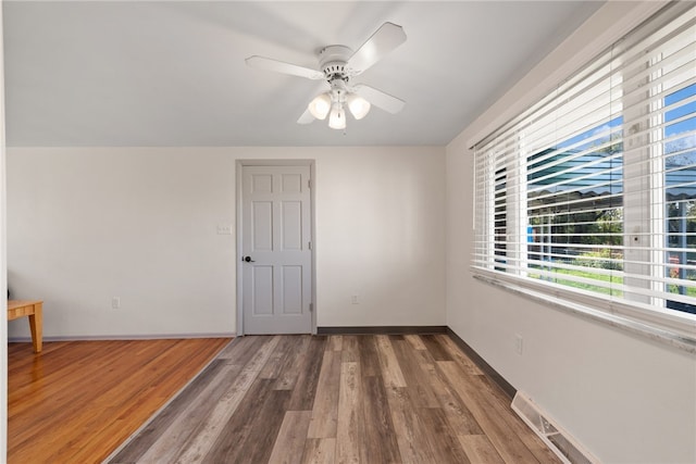 unfurnished room featuring wood-type flooring and ceiling fan