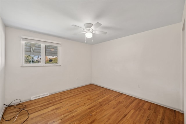 unfurnished room featuring light hardwood / wood-style floors and ceiling fan