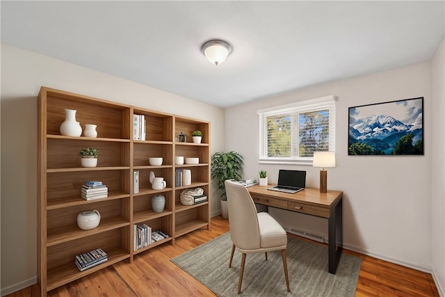 office space with light hardwood / wood-style floors