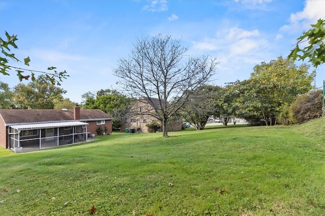 view of yard featuring a sunroom