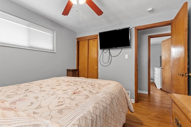 bedroom with light wood-type flooring and ceiling fan