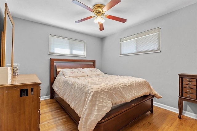 bedroom with ceiling fan and light wood-type flooring