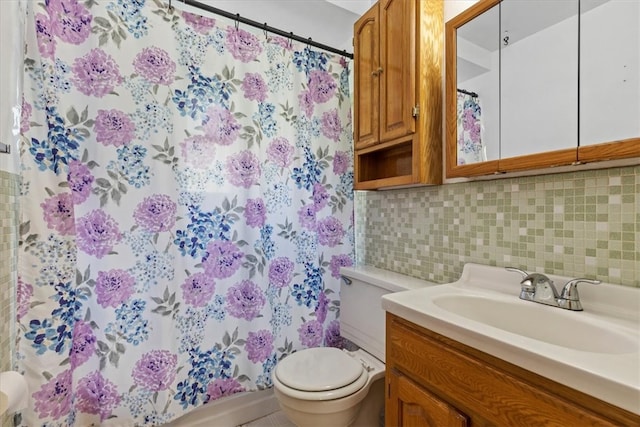 bathroom featuring decorative backsplash, walk in shower, vanity, and toilet