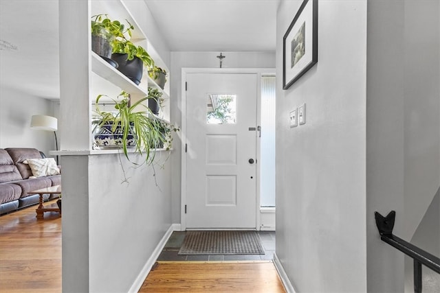 doorway with hardwood / wood-style floors