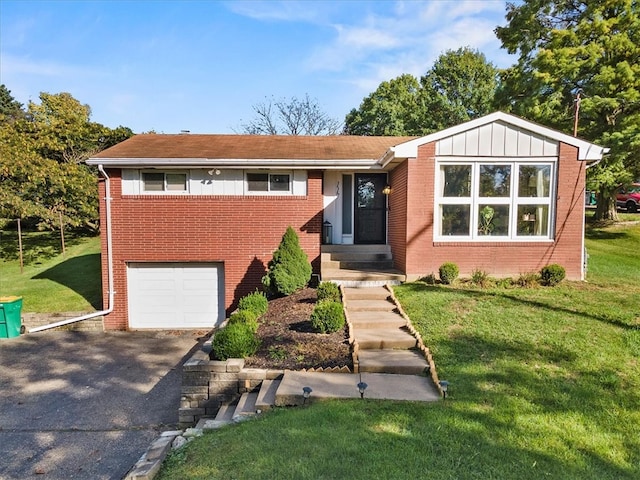 view of front of property featuring a garage and a front yard